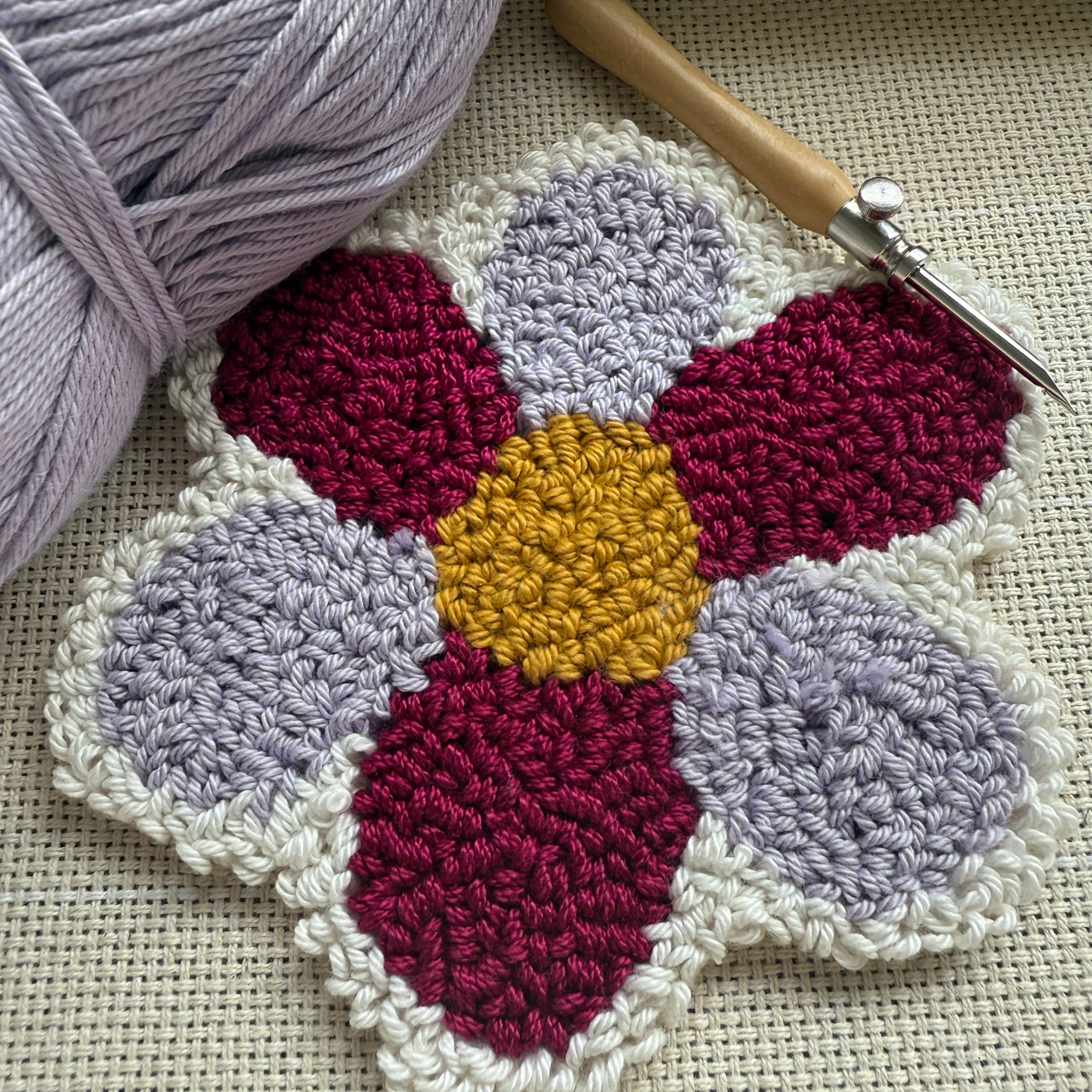 Punch needle pattern with yarn and Punch needle on a monks cloth