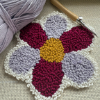 Punch needle pattern with yarn and Punch needle on a monks cloth
